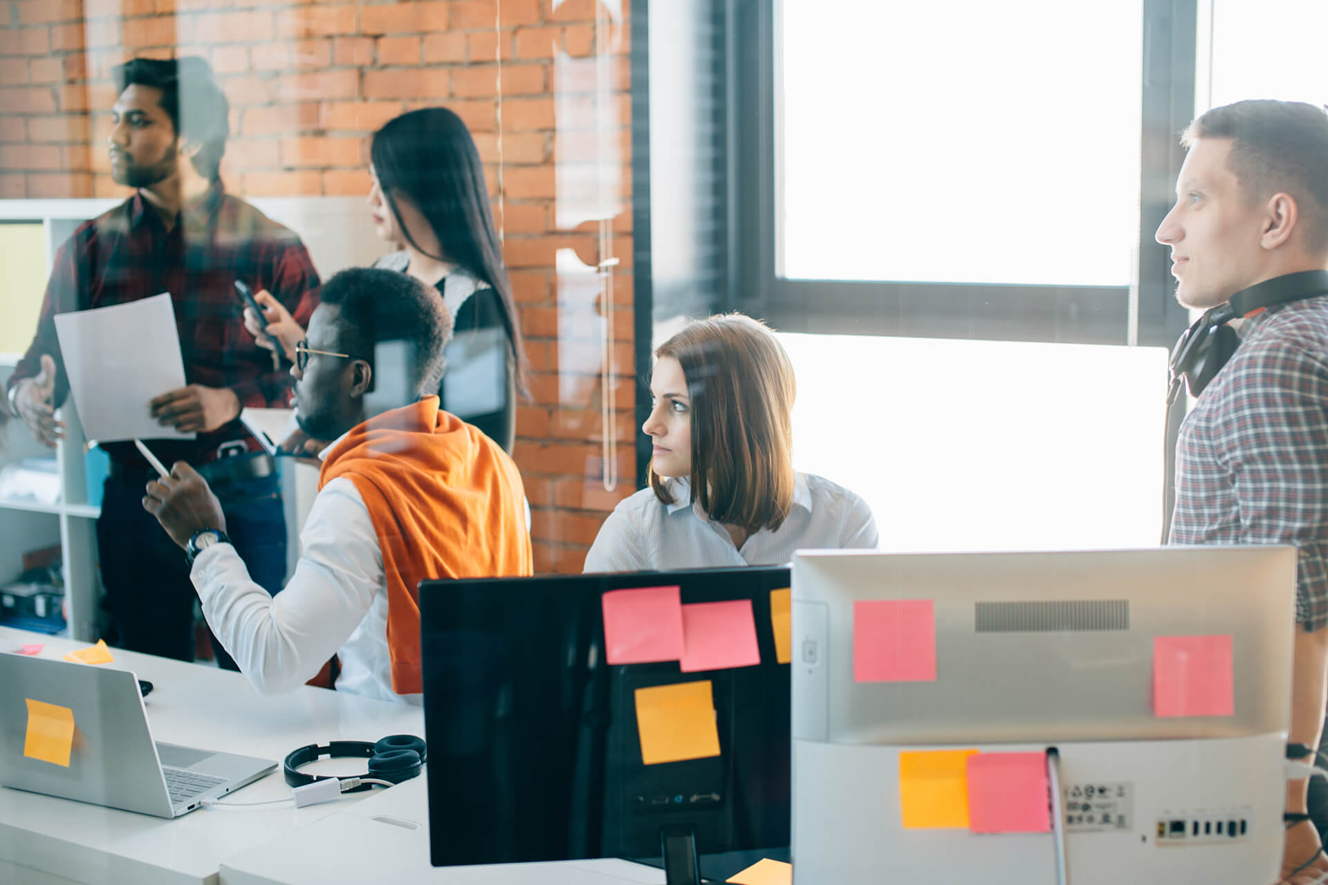 Attentive colleagues brainstorm solutions or analyze information for a project